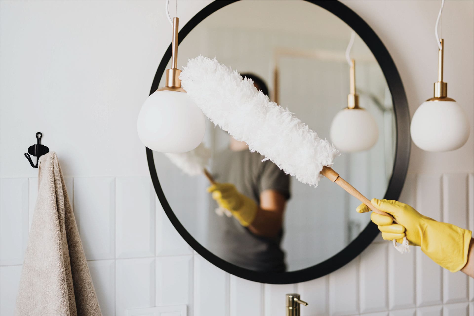 Cleaning a bathroom with duster